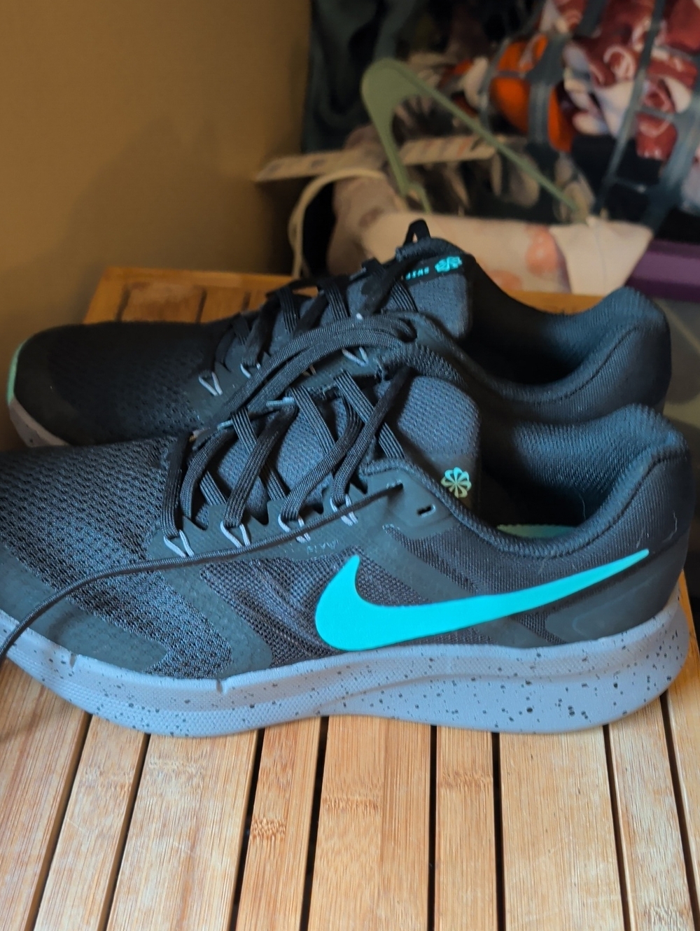 Nike Women's Black Athletic Shoes with Bright Teal Swoosh